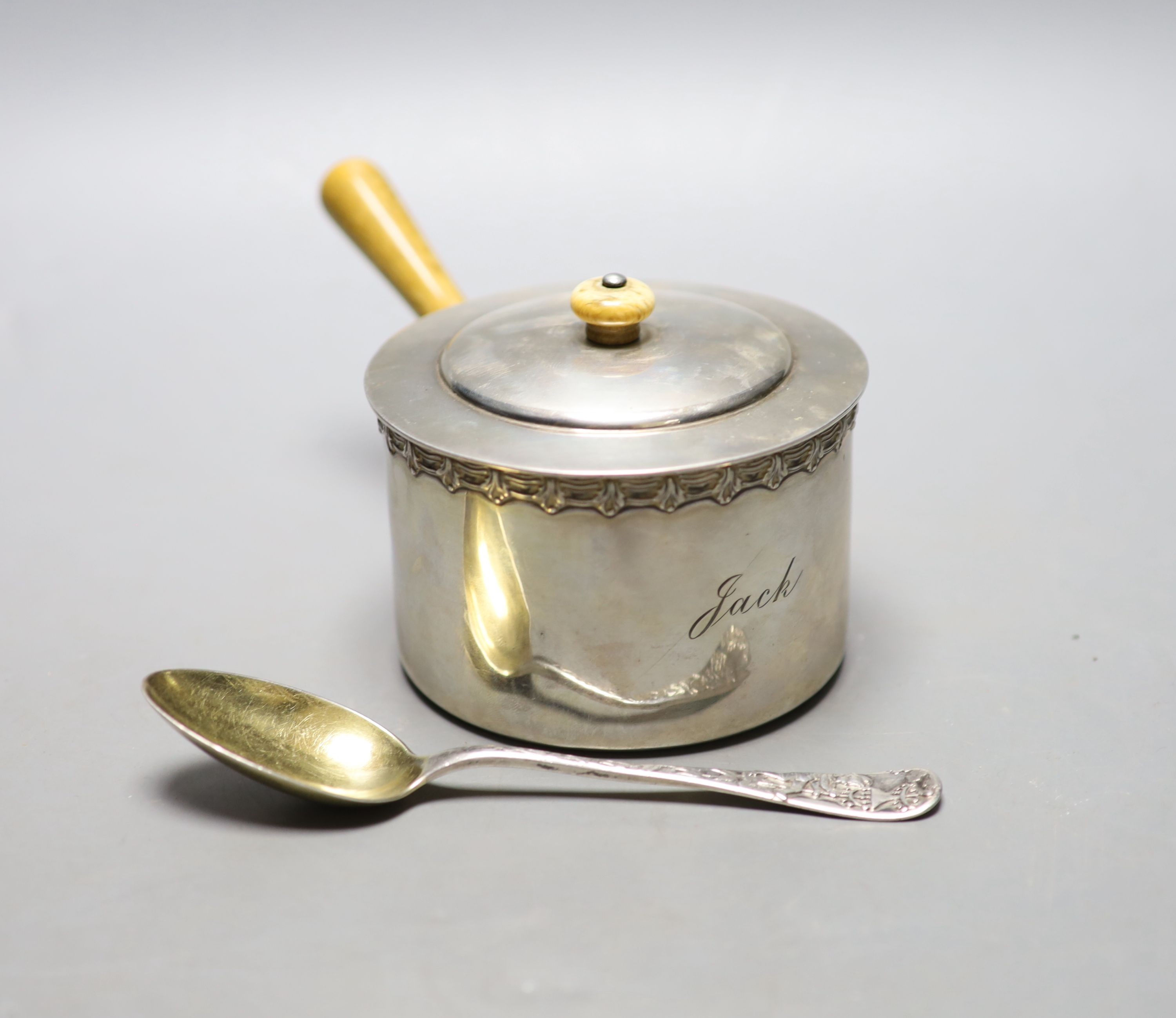 A late 19th/early 20th century Tiffany & Co sterling brandy warmer? and cover, length 16.7cm, and a Tiffany & Co sterling spoon, gross weight 8.5oz.